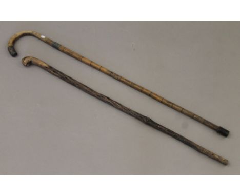 A Victorian silver-mounted walking stick and another. The former 90 cm long.
