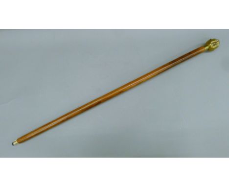 A four-faced Buddha-handled walking stick. 93 cm long.