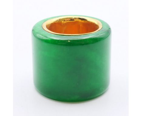 A jade archer's ring with a gilt interior.  3 cm high.
