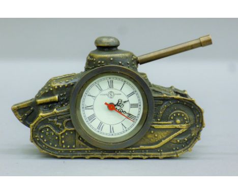 A bronze clock in the form of a tank. 16 cm long.