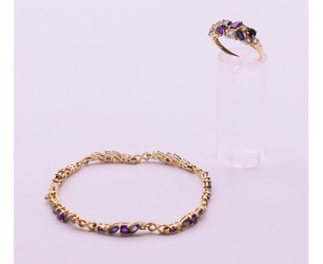 A 9 ct gold dress ring and a matching 9 ct gold bracelet.  Bracelet 18 cm long. Ring size Q. 11.3 grammes total weight. 