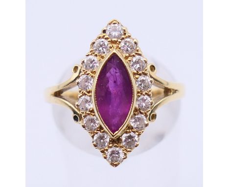 An 18 ct gold, diamond and ruby navette ring. Ring size P.