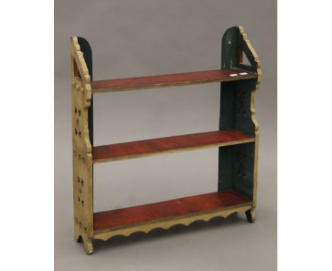 A Victorian painted hanging shelf. 57 cm wide x 62.5 cm high x 13.5 cm deep.