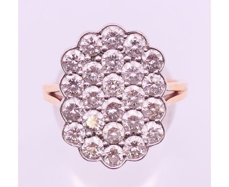 An unmarked gold diamond cluster ring. Ring size Q/R. 