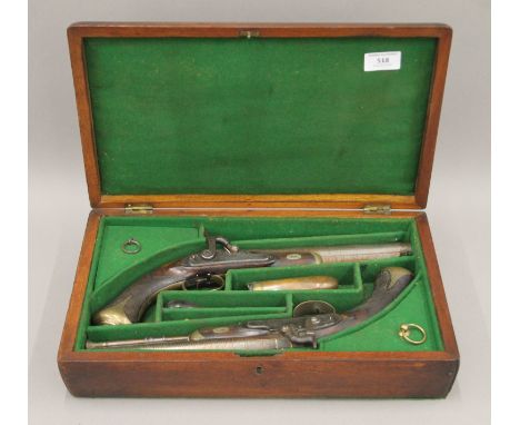 A 19th century boxed pair of duelling pistols by James Wilkinson & Son. The box 39 cm wide.