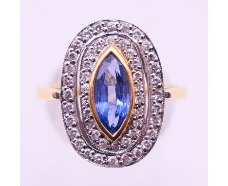 An 18 ct gold, diamond and sapphire ring. Ring size P/Q.