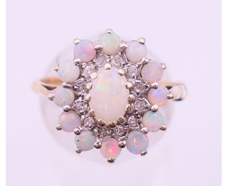 A 9 ct gold opal and diamond ring. Ring size O/P. 