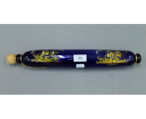 A Bristol blue glass rolling pin decorated with sailing ships. 38 cm long.