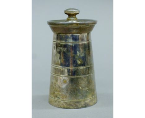 A silver pepper grinder formed as a milk churn. 8.5 cm high.