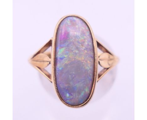 A 9 ct gold and opal ring. Ring size I/J. 