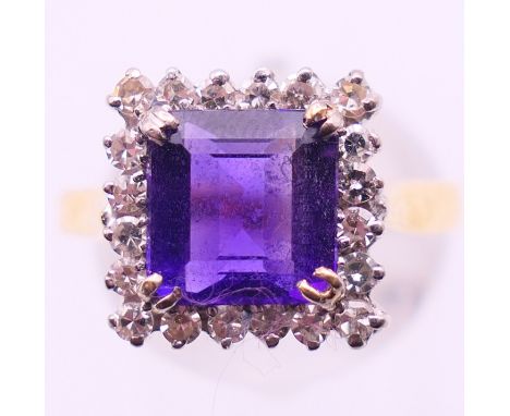 An 18 ct gold, diamond and amethyst ring. Ring size Q. 