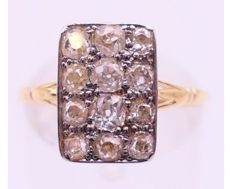An unmarked gold and diamond ring. Ring size P/Q.