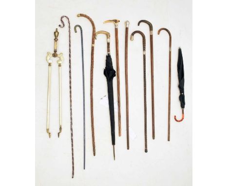 Five silver mounted walking sticks and canes, to include a horn-handled example and another with stag antler handle, 93cm and