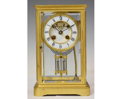 French four-glass mantel clock, circa 1900, the white-enamelled Roman chapter ring framing partially exposed Brocot escapemen