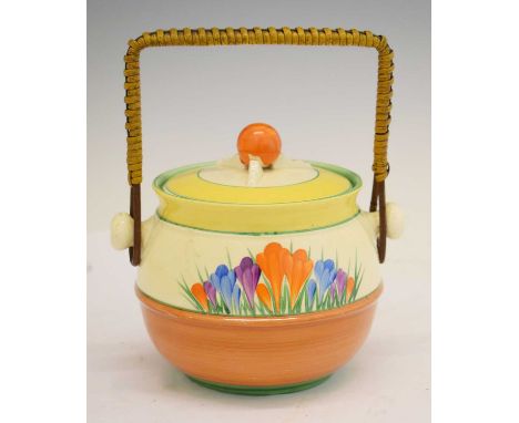 Clarice Cliff 'Crocus' pattern biscuit barrel and cover, ovoid with rattan carrying handle, 18cm x 15cm high 
