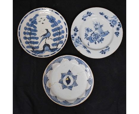 Mid 18th century Bristol delftware plate, decorated with a long tailed bird flanked by tall sponged trees, together with a de