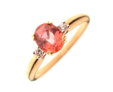 Orange sapphire and diamond 18ct gold ring, the oval stone measuring approximately 5.5mm x 7mm, with a small diamond to each 