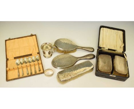 Assorted silver dressing table requisites, including a cased pair of dressing brushes, and a hand mirror with matching brush,
