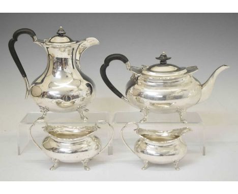 George V silver four-piece tea set comprising teapot, sugar bowl, milk jug and hot water pot, sponsor's marks of Atkin Brothe