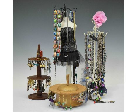 Assorted costume jewellery and display stands, to include bead necklaces, chains and pairs of earrings, on two treen display 