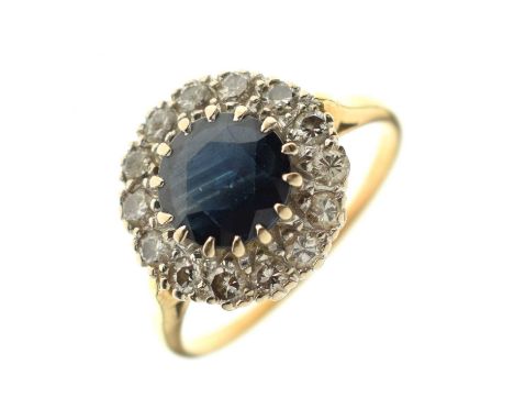 18ct gold sapphire and diamond cluster ring, fourteen diamonds surrounding the circular sapphire, London 1968, size Q, 4.2g g
