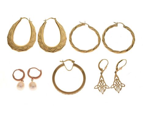 Group of assorted gold and yellow metal earrings, comprising two pairs of 9ct gold hoops, one single hoop earring, Celtic kno