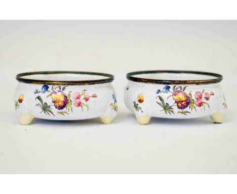 Pair of 18th century South Staffordshire enamel cauldron salts, of circular form on three feet, painted with floral sprays an