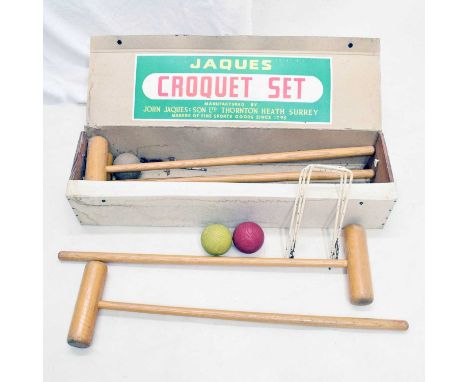 Jaques &amp; Son Ltd. croquet set in pine and cardboard box, comprising; four mallets, four balls, metal hoops and centre peg