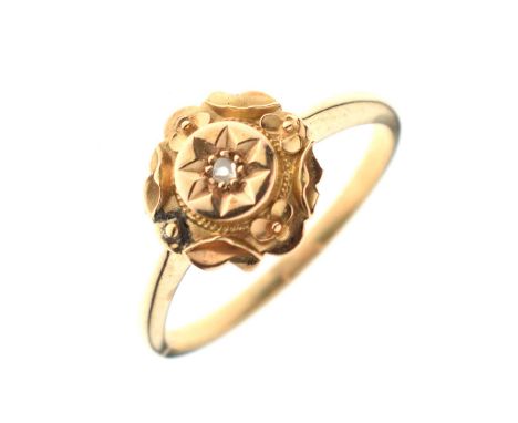 Unmarked yellow metal ring, the central circular panel set a diamond, size Q, 2.6g gross approx