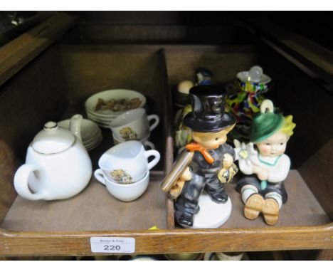 A Goebel figure of a window cleaner 13.5cm high, a Reutter porcelain miniature tea service with Hummel designs, other figurin