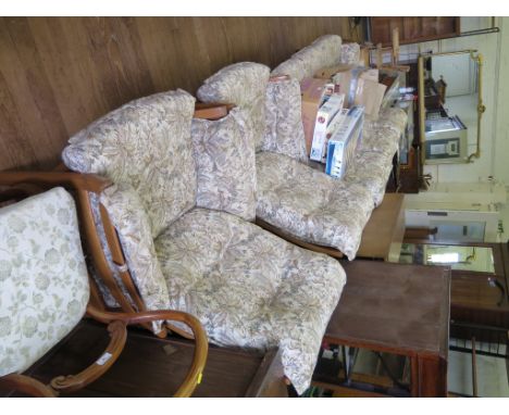 An oak Ercol Saville three piece suite, comprising three seat settee and two armchairs