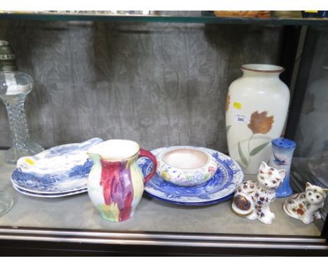 A Poole Pottery floral design dish, 14.5cm diameter, a modern Poole Pottery vase, blue and white plates and ornaments