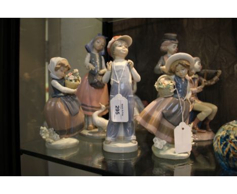 Six Lladro figures including 5856 Clowns playing horn and violins, 5466 girl by a telephone and others of children