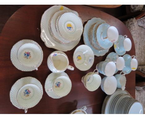 A Paragon Fleur de Lis pattern part tea service with floral painted panels, nineteen pieces, and an Aynsley part tea service,