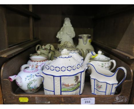 A 19th century four piece Prattware tea service with impressed classical decoration painted panels and blue highlights, as fo