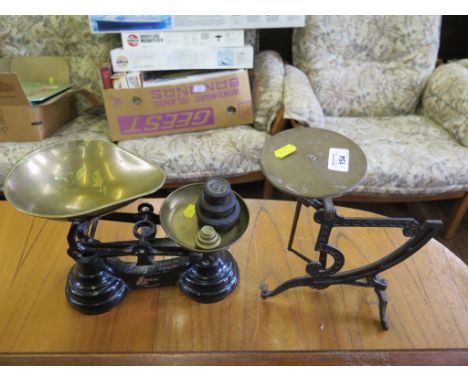 A set of postal scales and kitchen scales, with weights