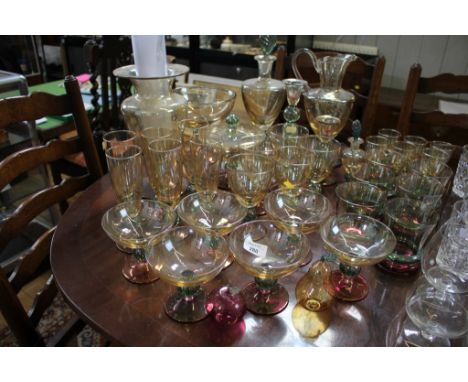 A collection of Krosno tricolour Polish glassware including drinking glasses, vases and vessels