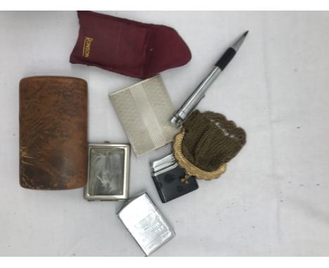 A vintage nude lighter and vesta case; together with a snuff box, purse and compact
