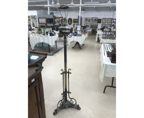 A telescopic oil lamp converted to electric; together with a large silvered lamp in the form of a woman water carrier