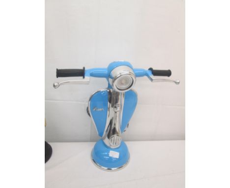 A lamp in the form of a Vespa