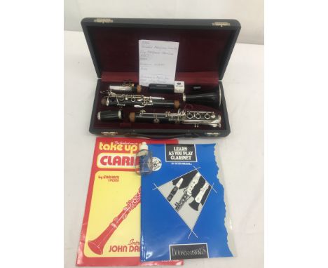 A cased Maripaux King clarinet; together with two clarinet programmes