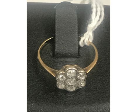 An Edwardian diamond daisy ring