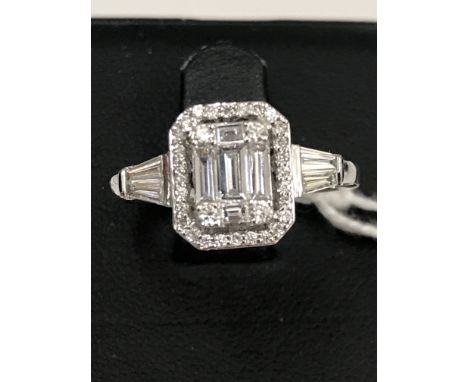A 0.95ct G/VS1 diamond halo ring set in 18ct white gold