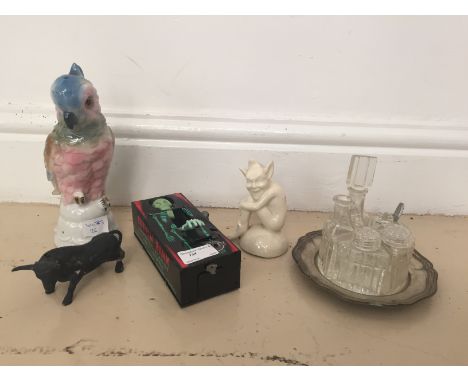 An EPNS and glass cruet; together with a Pixiebird lamp and novelty skeleton moneybox