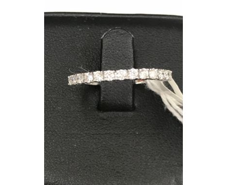 A 0.75ct H/SI2 diamond half eternity ring set in 18ct white gold