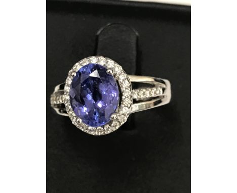 A 3ct tanzanite and diamond ring set in 18ct white gold