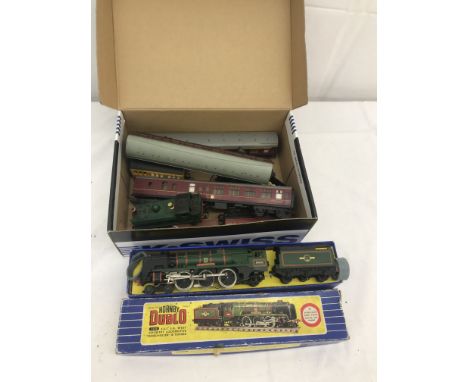 A boxed Hornby Dublo gauge West Country locomotive; together with a quantity of train carriages, engine etc