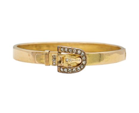 A Victorian gold hinged bangle diamond set with a buckle design clasp, signed DENIS BRO. The buckle clasp set with 19 rose cu