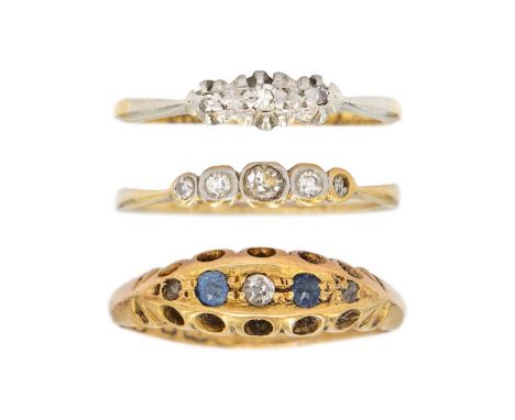 A selection of three diamond set rings.  One is a five stone ring with one stone deficient, size J 1/2, one is a single stone