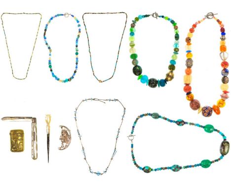 A quantity of costume jewellery.  To include two possibly ancient Egyptian faience bead necklaces, an African white metal ban